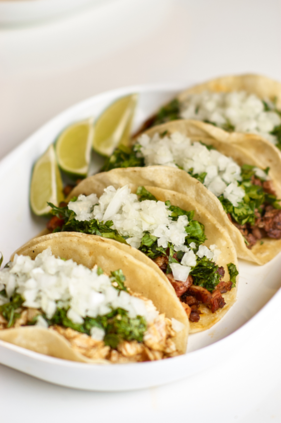 A plate of TexMex Cafe signature Tex-Mex dishes with house-made salsas and warm tortillas